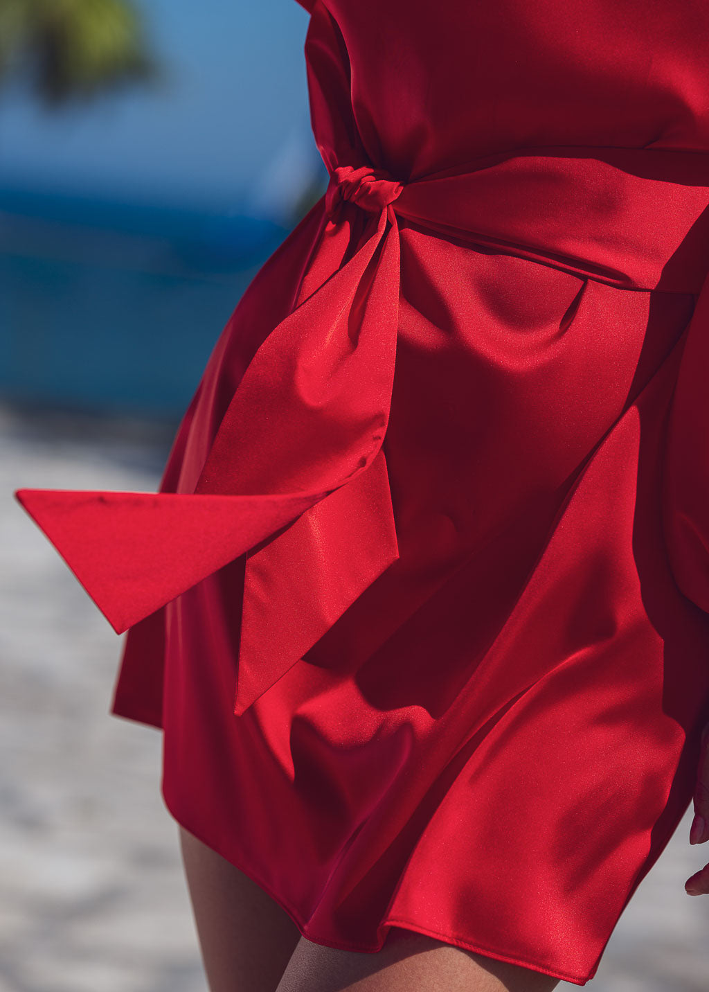 Red open shoulder silk dress with belt